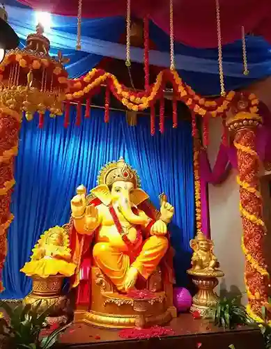 Vibrant floral Ganpati pandal decoration with marigold and drapery | ganesh chaturthi decoration ideas | Festival Decorations | Decorations Guru